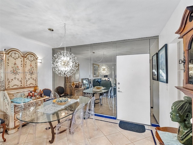 tiled dining area featuring a chandelier