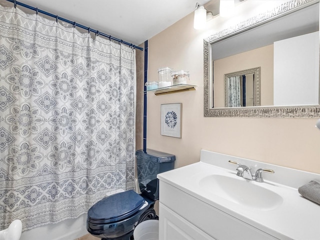 full bathroom featuring shower / bath combo with shower curtain, vanity, and toilet