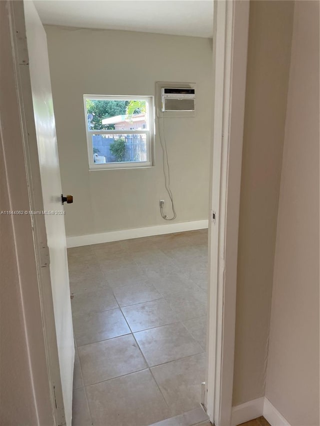 bathroom with tile patterned floors and a wall mounted air conditioner