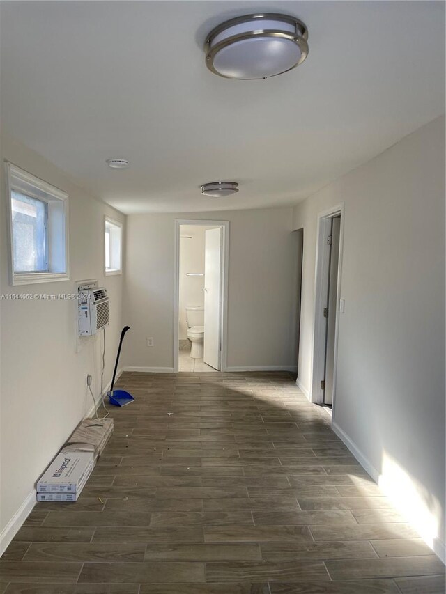 hallway featuring dark hardwood / wood-style flooring