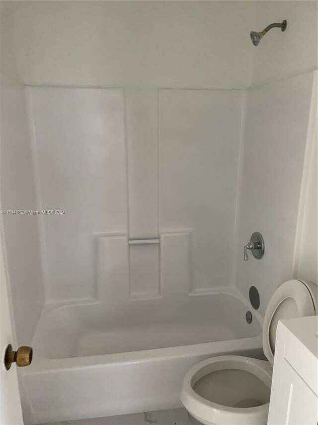 full bathroom with vanity, shower / bath combination, and toilet