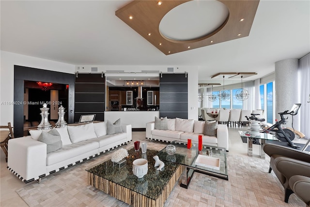 living room featuring a tray ceiling