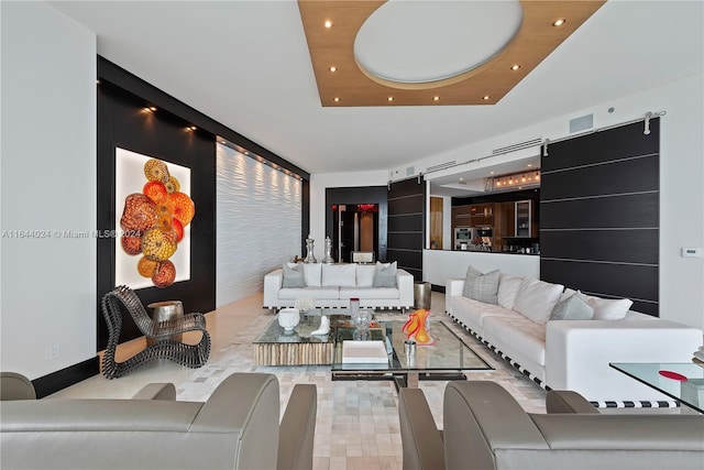 living room with a tray ceiling