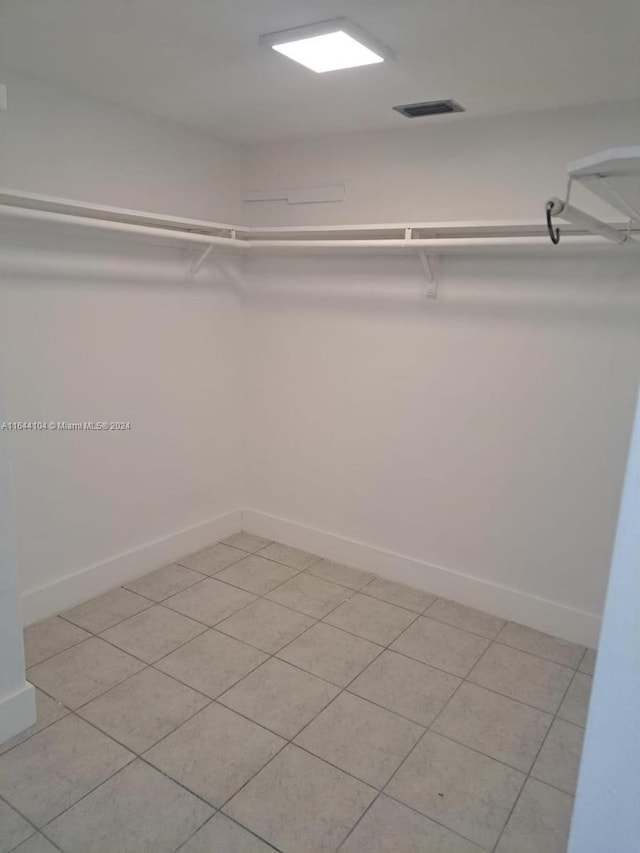 walk in closet featuring light tile patterned floors