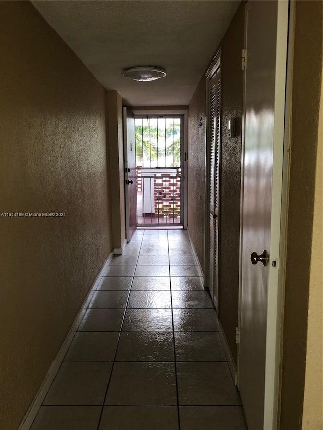 hall featuring tile patterned flooring