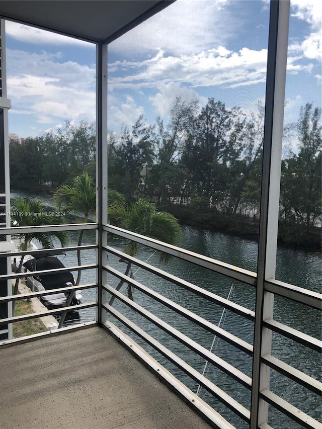 balcony featuring a water view