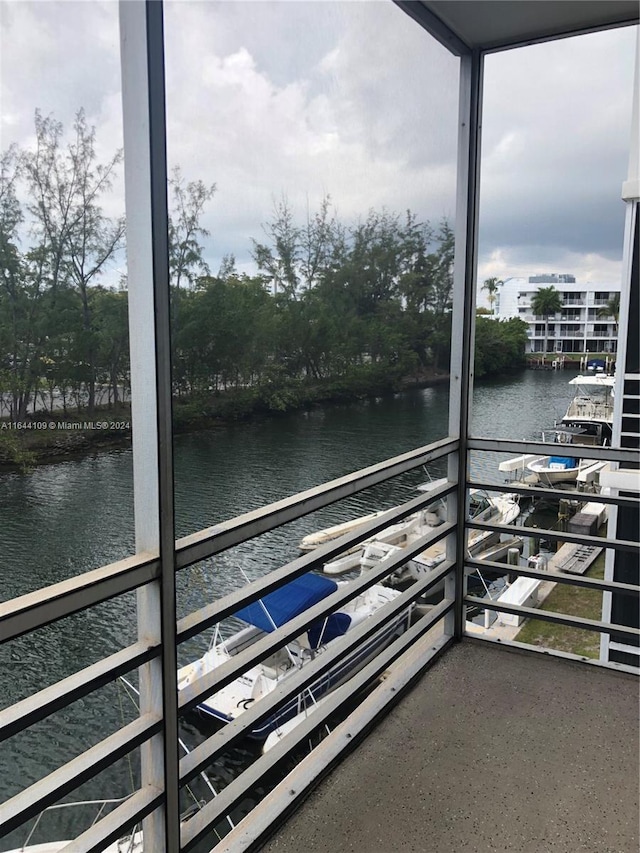 balcony featuring a water view