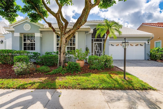 view of front of home with a garage