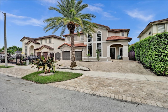 mediterranean / spanish home featuring a garage