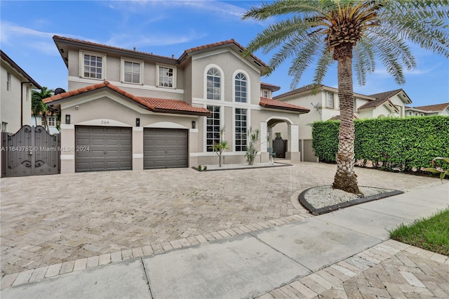 mediterranean / spanish house with a garage