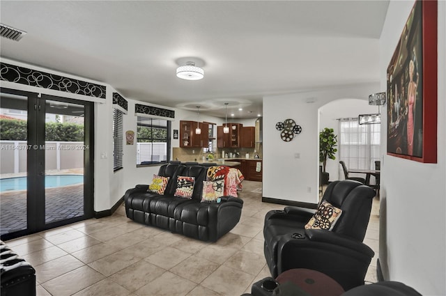 living room featuring light tile patterned flooring