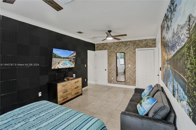 bedroom featuring light tile patterned floors and ornamental molding