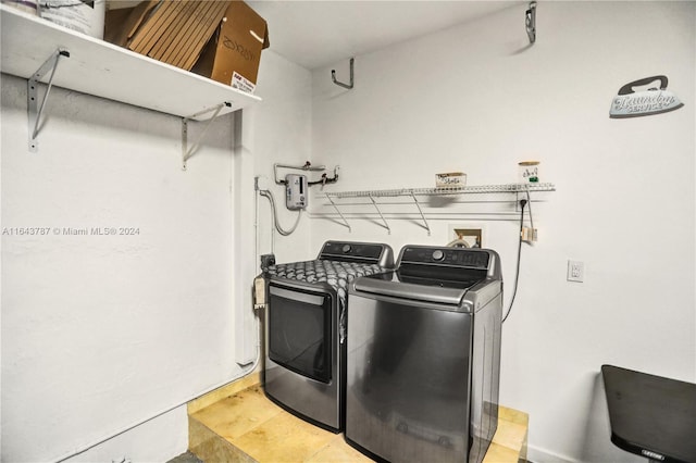 laundry room featuring separate washer and dryer