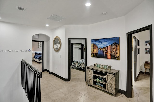 corridor featuring light tile patterned flooring