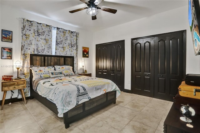 bedroom featuring multiple closets and ceiling fan