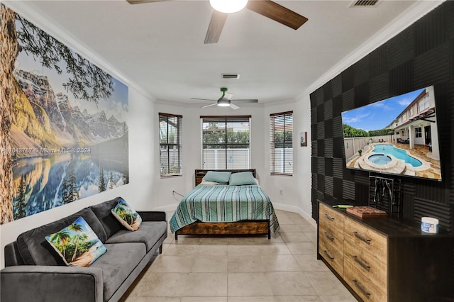 bedroom with ceiling fan, ornamental molding, and light tile patterned floors