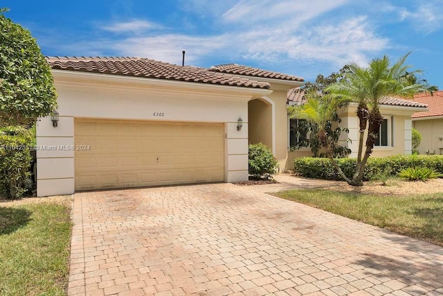 mediterranean / spanish-style house featuring a garage