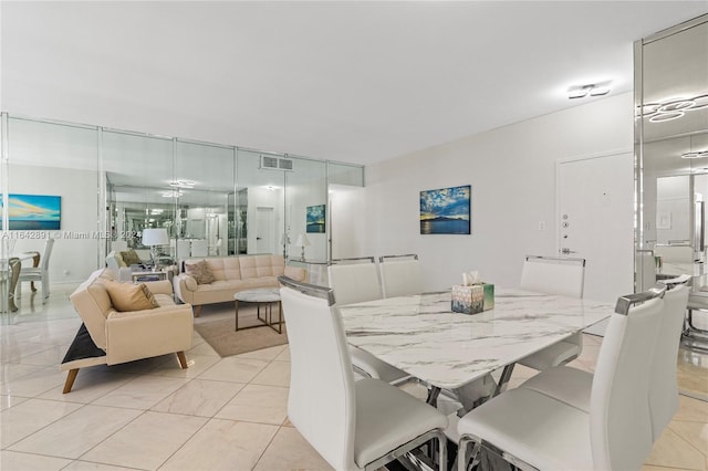 dining area with light tile patterned flooring