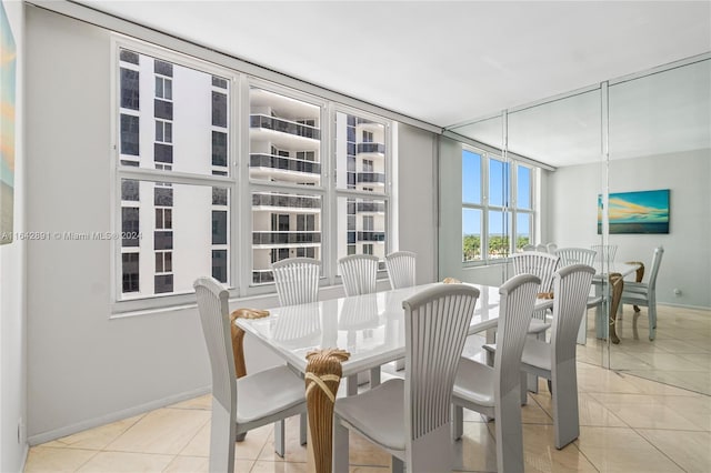 dining space with light tile patterned floors