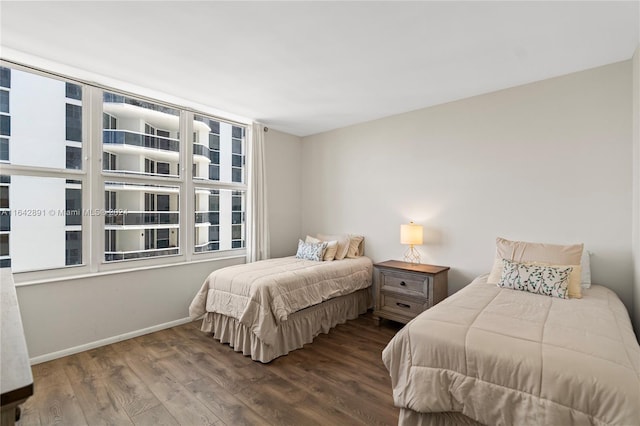 bedroom featuring dark wood-type flooring