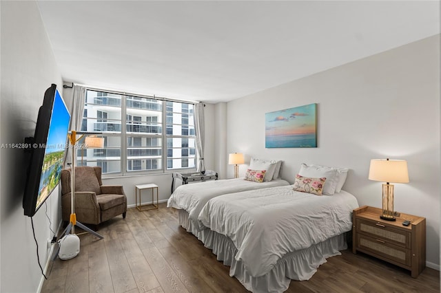 bedroom featuring wood-type flooring