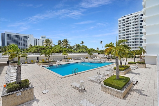 view of swimming pool with a patio