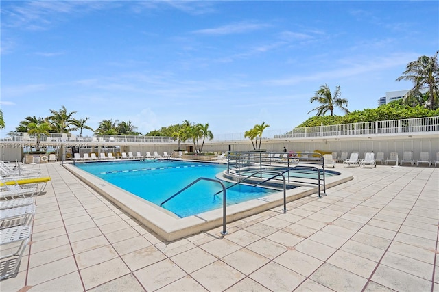 view of pool featuring a patio