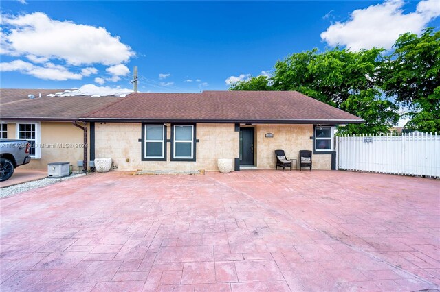 back of property featuring a patio