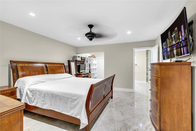 bedroom with ceiling fan and light tile patterned floors