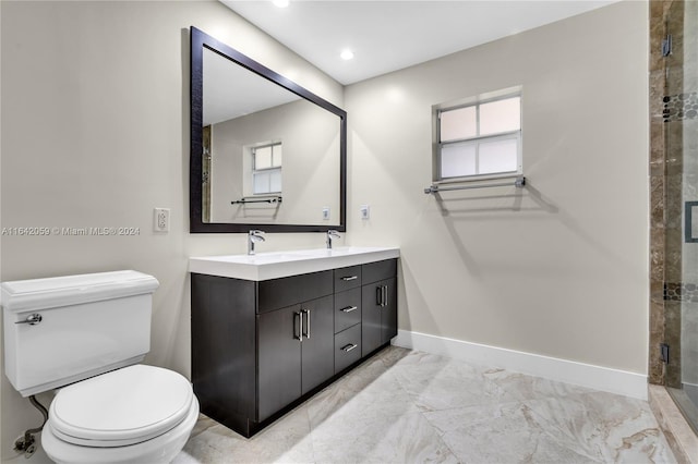 bathroom with tile patterned floors, vanity, walk in shower, and toilet