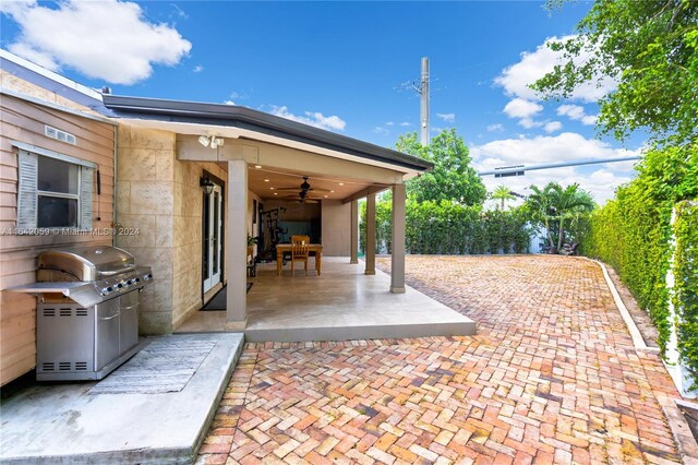 view of patio / terrace featuring ceiling fan and area for grilling