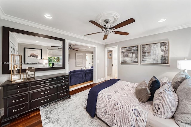 bedroom featuring ornamental molding, dark wood-type flooring, a ceiling fan, and recessed lighting