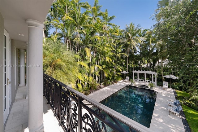 balcony featuring a pergola