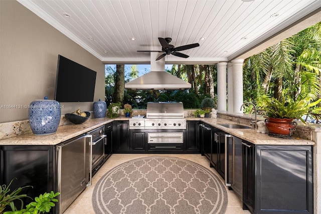 view of patio featuring outdoor dining space, a sink, area for grilling, and ceiling fan