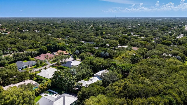 birds eye view of property with a residential view and a view of trees