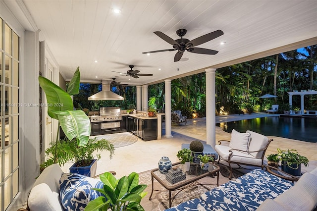 view of patio featuring an outdoor pool, an outdoor living space, an outdoor kitchen, and grilling area