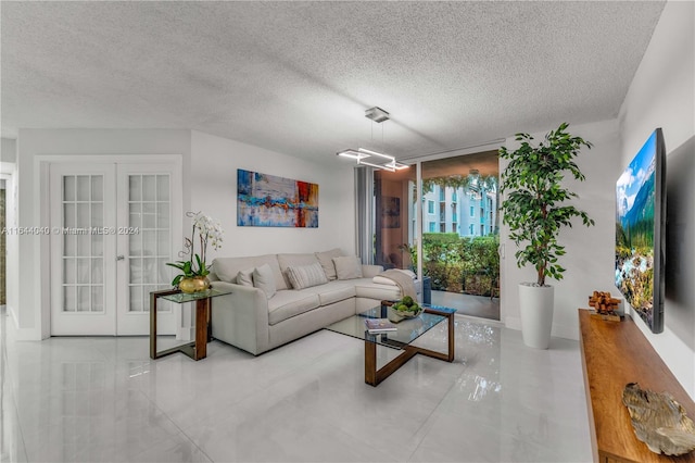 tiled living room with french doors and a textured ceiling