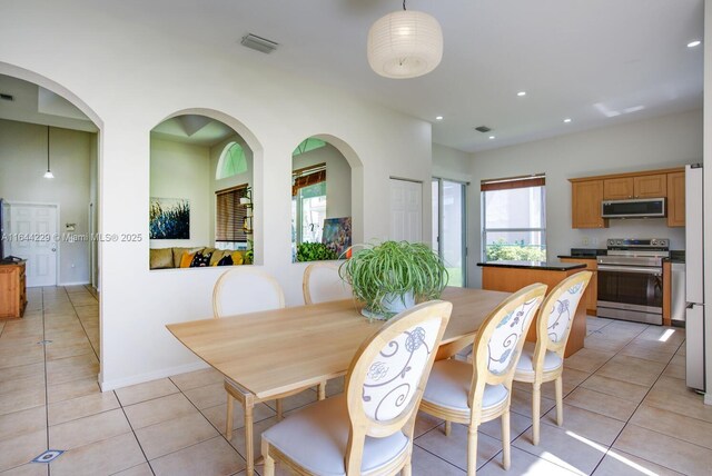 dining area featuring light tile patterned floors