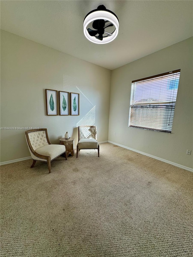 unfurnished room featuring carpet flooring and baseboards