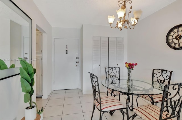 dining room with light tile patterned floors and a notable chandelier