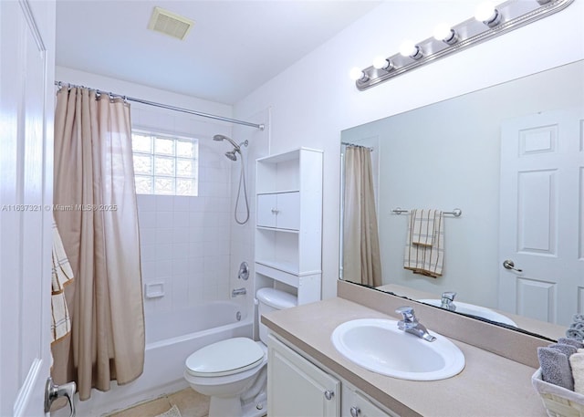 full bathroom featuring tile patterned floors, vanity, toilet, and shower / bathtub combination with curtain