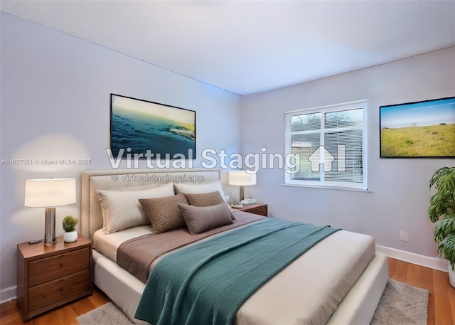 bedroom with wood-type flooring