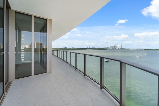 balcony featuring a water view