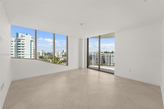 tiled empty room with expansive windows