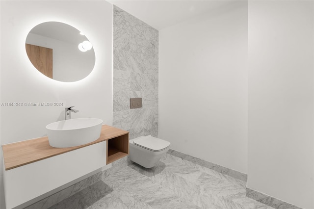 bathroom with tile patterned flooring, toilet, and vanity