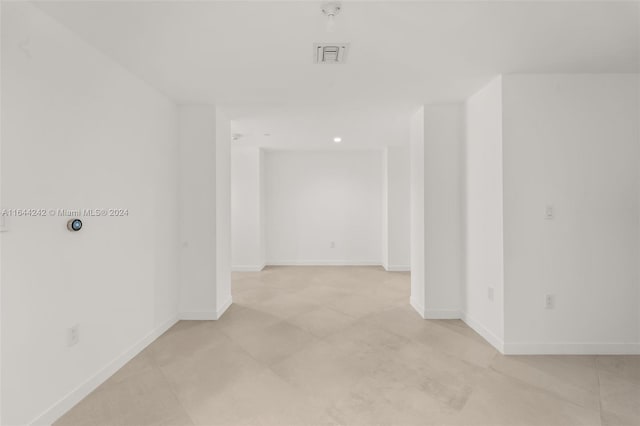 unfurnished room featuring light tile patterned floors