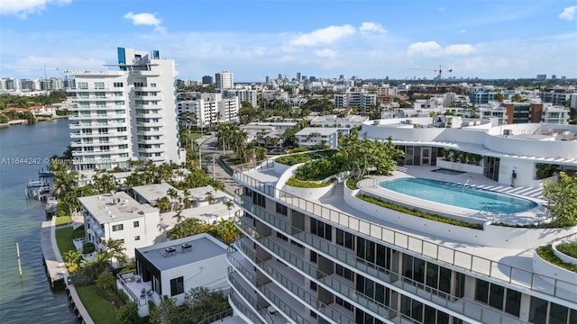 birds eye view of property with a water view