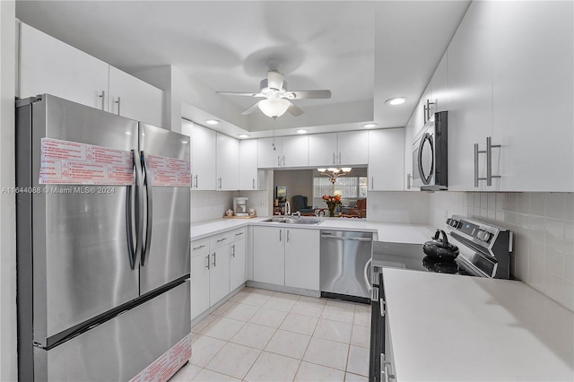 kitchen with stainless steel appliances, tasteful backsplash, sink, ceiling fan, and light tile patterned flooring