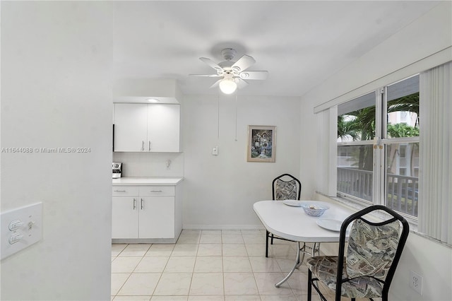 dining area with ceiling fan and light tile patterned floors