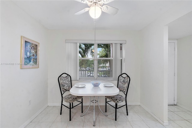 dining area featuring ceiling fan and light tile patterned floors